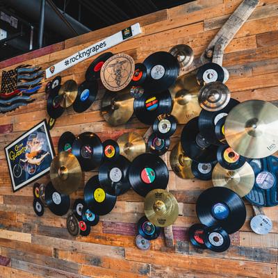 Interior, a wooden wall decorated with a bunch of vinyls.