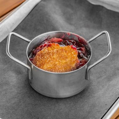 A pot with cherry cobbler.