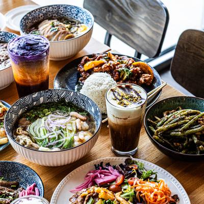 Various dishes and drinks served on the table, side view