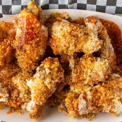 Crispy chicken wings covered in a spicy seasoning.