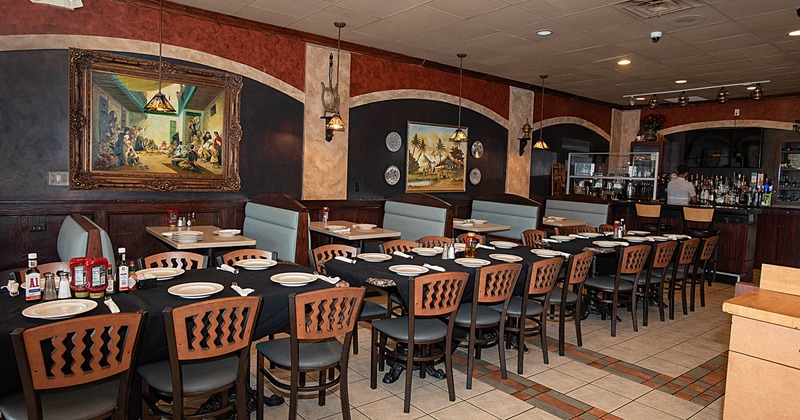 Interior, tables with tableware and chairs lined up