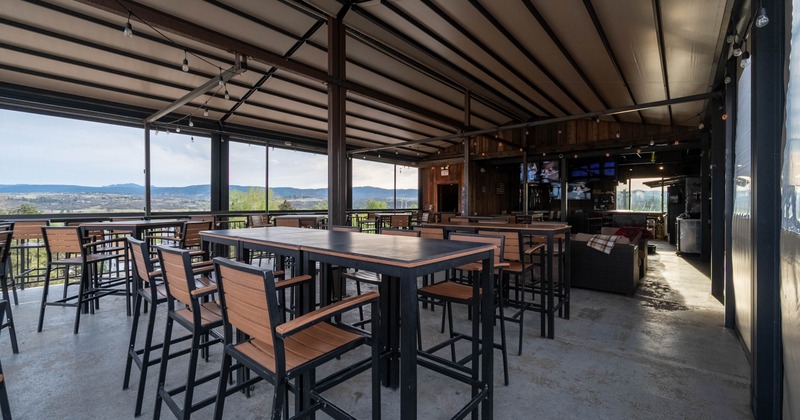 Covered patio with high tables and chairs