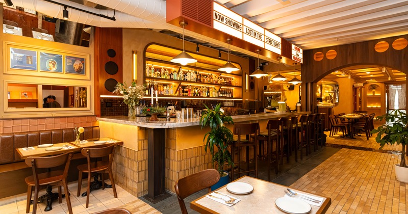 Interior, bar area, marble top bar with stools, large drink shelf in the back