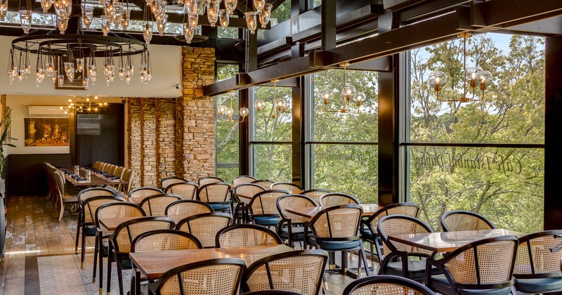 Interior, tables and chairs near large window
