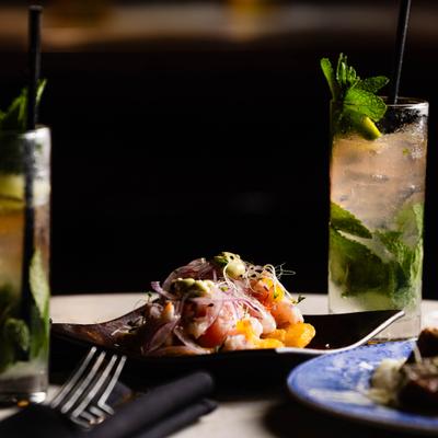 Seafood Tostones with mojito in the background.