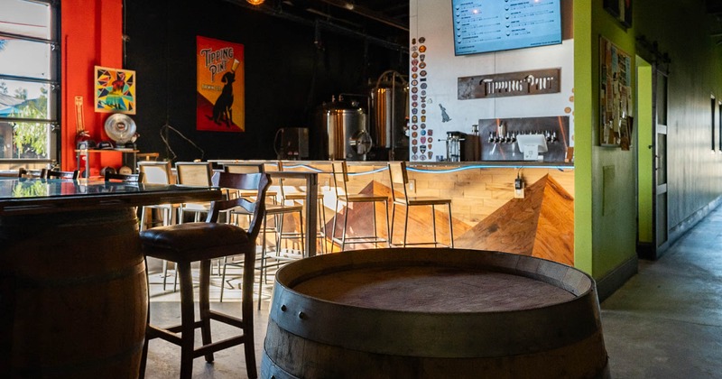 Interior, bar with stools and a barrel as a table