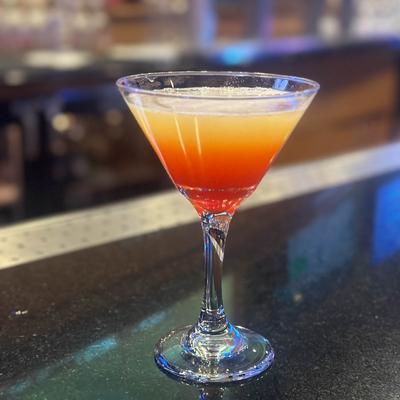 Layered cocktail in a martini glass.