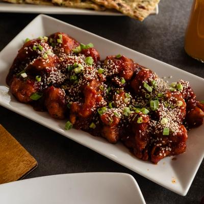 Cauliflower in hot, sweet, and tangy sauce.