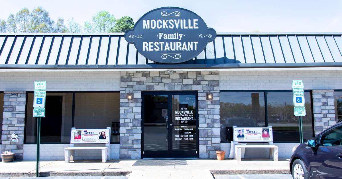 Exterior, front view to restaurant, part of parking lot