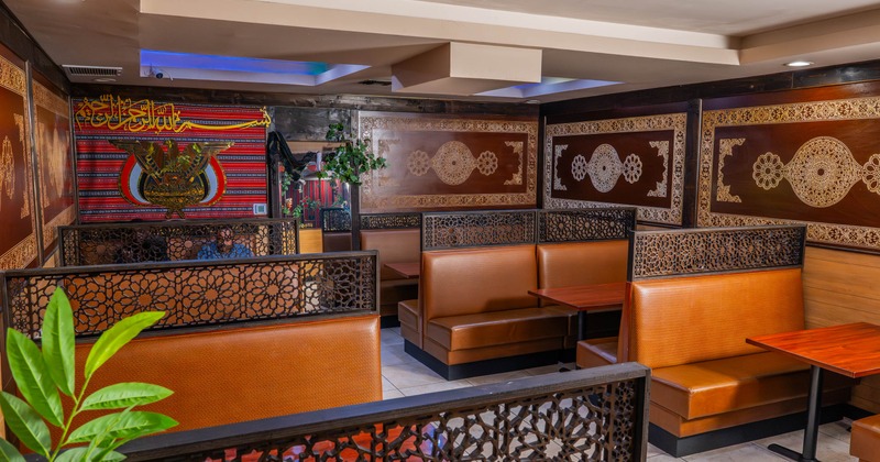 Interior, dining area, leather sheathed seating booths with tables, Arabian motif decoration