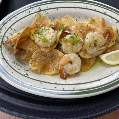 CLAY'S FAVORITE PAN FRIED REDFISH TOPPED WITH HOMEMADE POTATO CHIPS & GRILLED SHRIMP.
