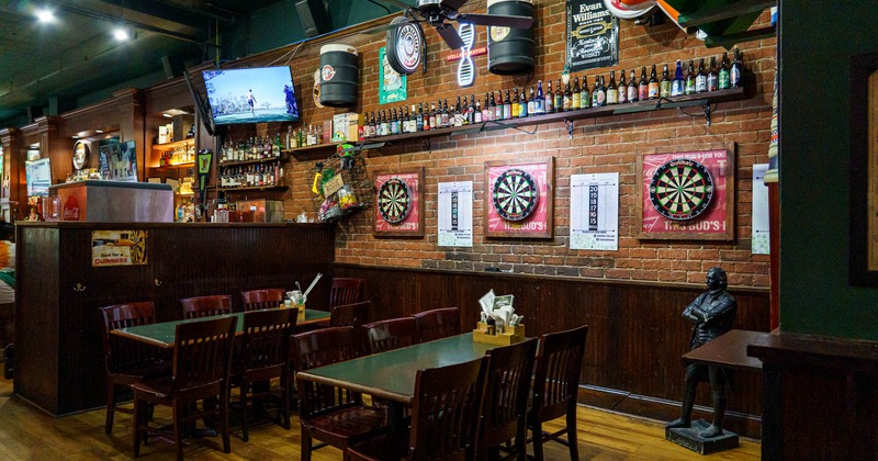 Interior, dining tables and chairs, dart boards on the wall