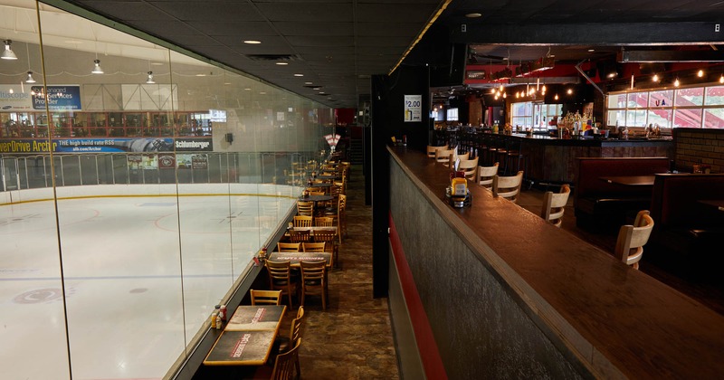 Interior, dining tables and chairs near the windows