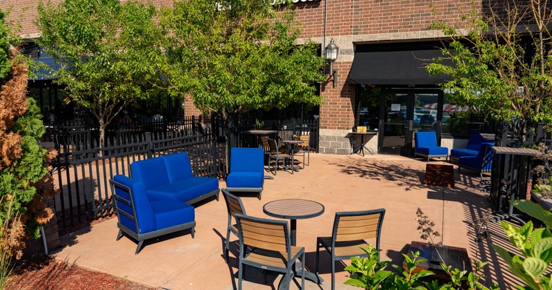 Exterior, seating area, sofa with chairs, small round table with three chairs