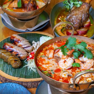 Shrimp hot pot accompanied by spicy grilled sausages, and a lamb shank.