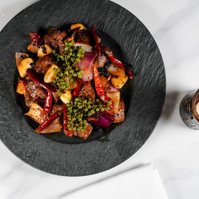 Stir fried marble beef cubes with vegetables.