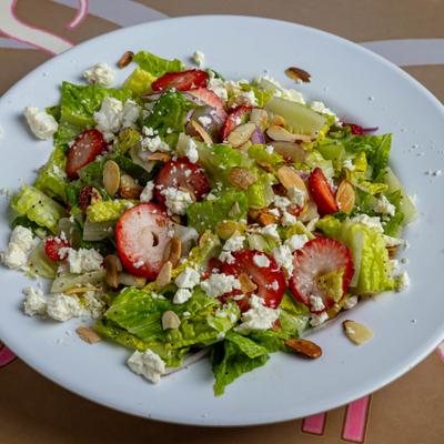 Tiffany Salad with strawberries, almonds, feta and poppy seed dressing.