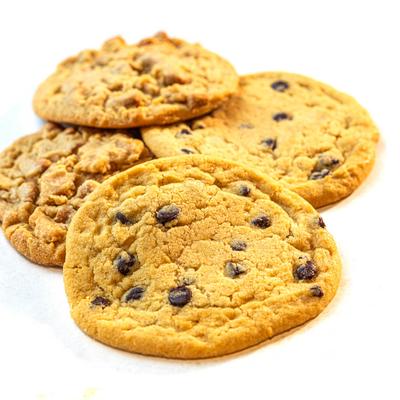 A pile of chocolate chip cookies isolated on white background.