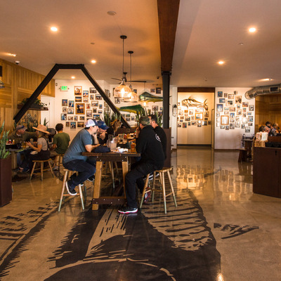Interior, seating area with people sitting around.