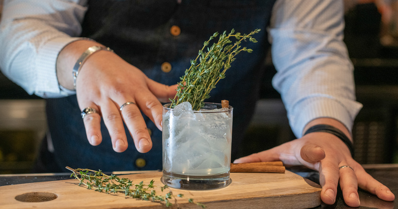 Bartender serving a cocktail