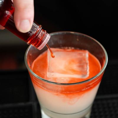 Bartender making a cocktail.