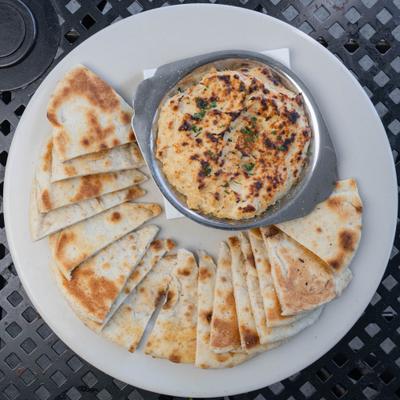 Crab Dip served with sliced pita bread.