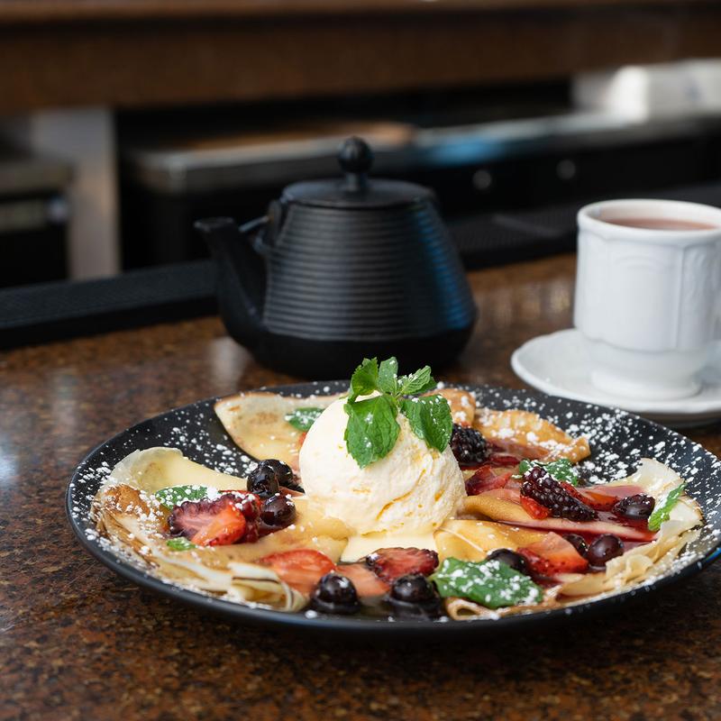 Blini With Hot Berries and Ice Cream photo