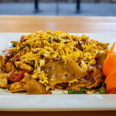 Stir fried flat noodle  dish with veggies