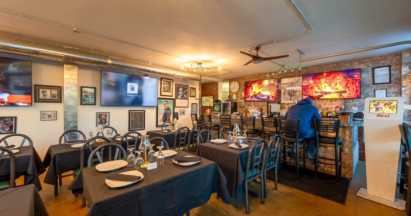 Interior, seating area with a bar in the back