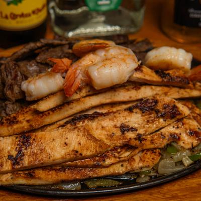 Chicken, shrimp, and steak Fajitas.