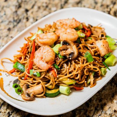 Stir fried noodles with shrimp, mushrooms, and veggies.