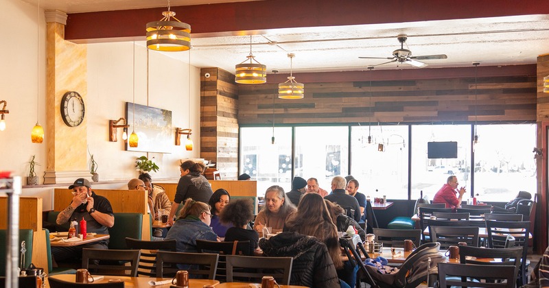 Interior, seating area, guests chatting and enjoying their food and drinks