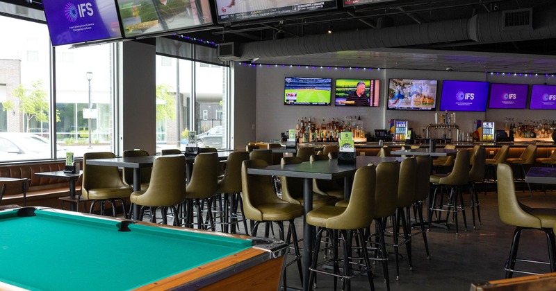 Interior, pool table with seating area behind