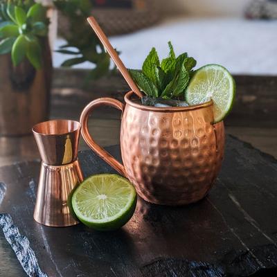 Moscow Mule garnished with mint spring and lime wheel.