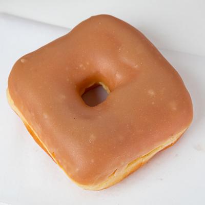 A square-shaped donut with maple icing.