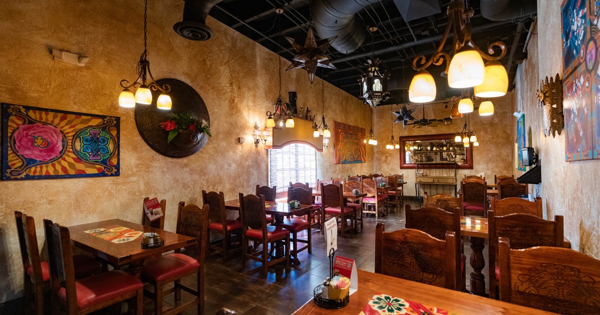 Inside, tables, chairs, art on the wall