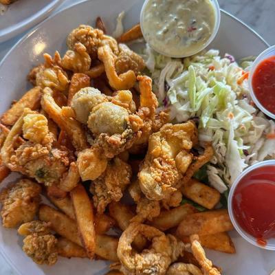 Platter of fried seafood, served with fries, closeslaw and dipping saices.