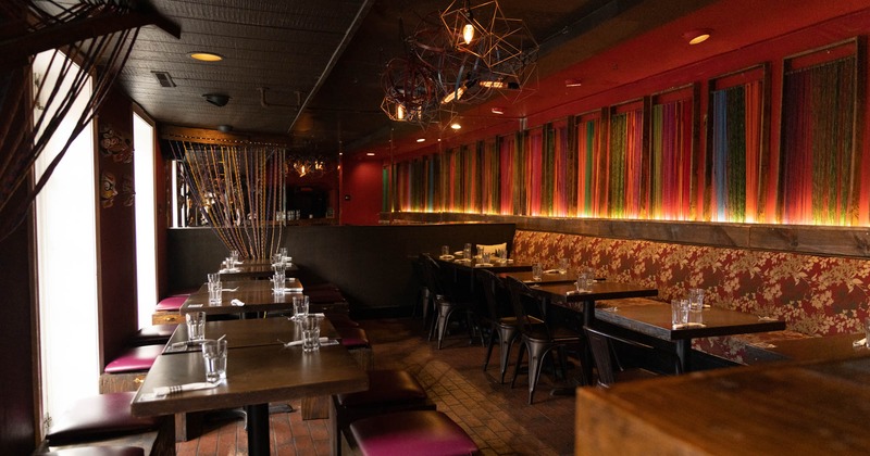 Bench seating on the right, tables and chairs