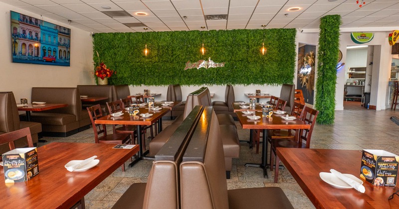 Interior, dining area, wooden top tables with chairs and banquette benches