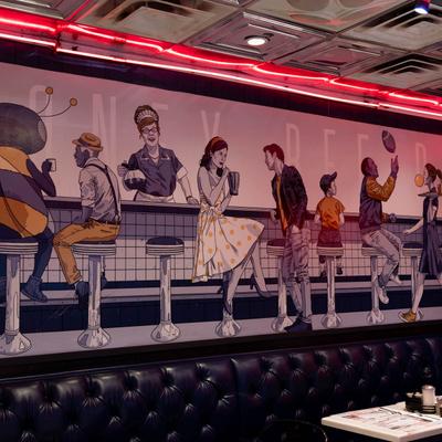 Mural depicting customers in a diner.