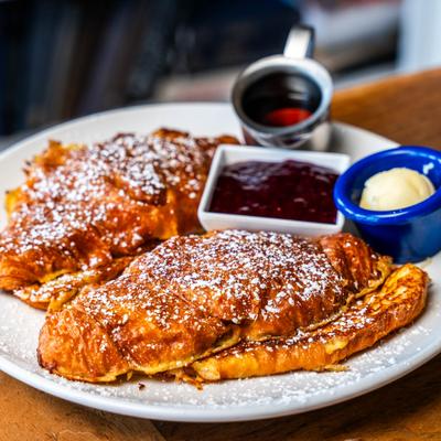 Stuffed French Toast served with jam, butter and syrup.