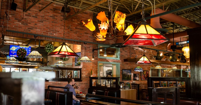 Side view to diner area, booths, chandeliers, decoration