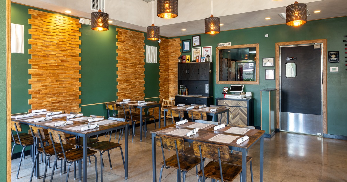 Cozy interior dining area with dining tables set for guests