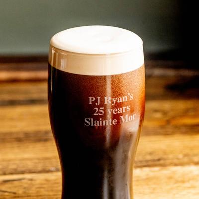 Dark beer in a branded glass.