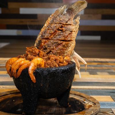 Molcajetes Nayarit with whole fish and shrimp.