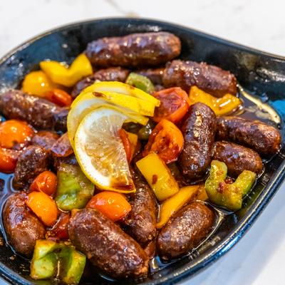 Aromatic sausage sauteed with mixed bell peppers and cherry tomato.