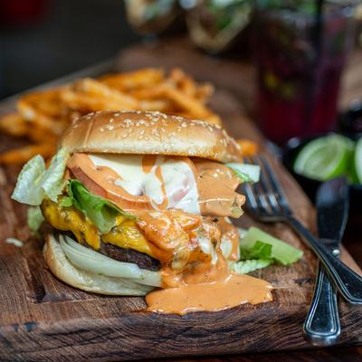 Grilled Burger with side of fries.