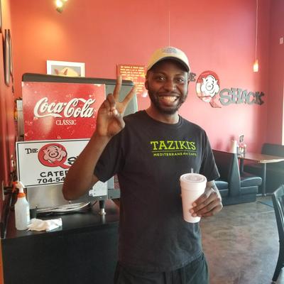 A person holiding a beverage.