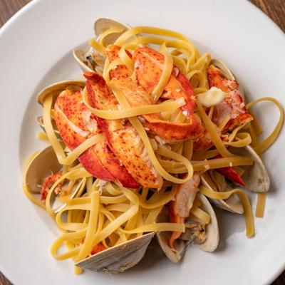 Fettuccini with lobster and whole clams.
