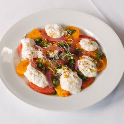 Tomato salad with creamy cheese.